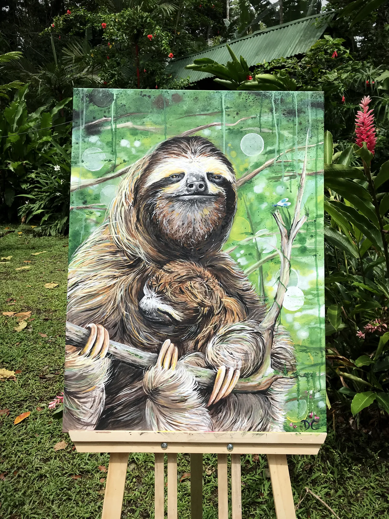 Sloth with her baby, painting on the easel by Damián Calandra
