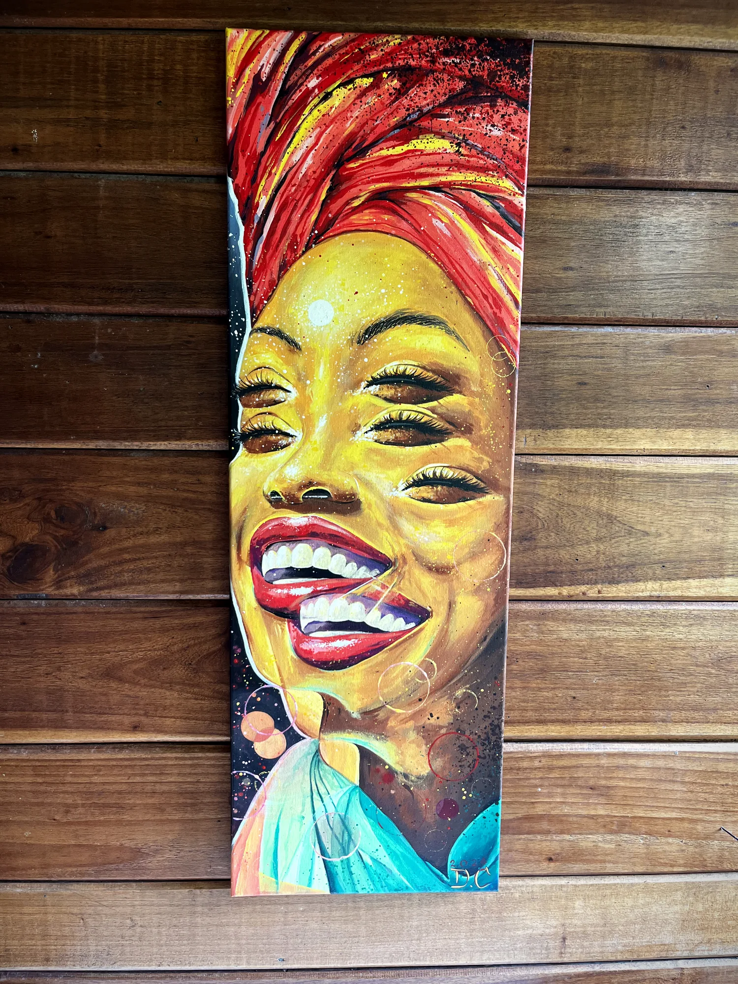 Portrait of a woman with a red headwrap by Damián Calandra