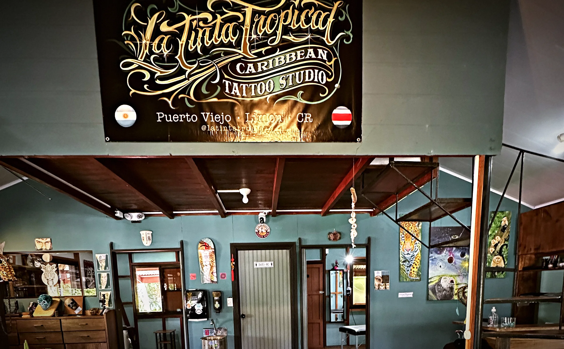 The studio under the Caribbean Tattoo Studio sign