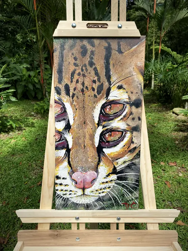 Ocelot painting on the easel by Damián Calandra