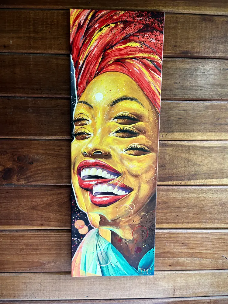 Portrait of a woman with a red headwrap by Damián Calandra