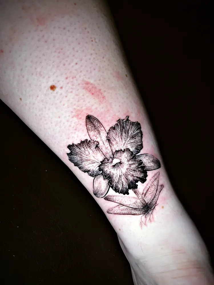Orchid tattoo by Damián Calandra