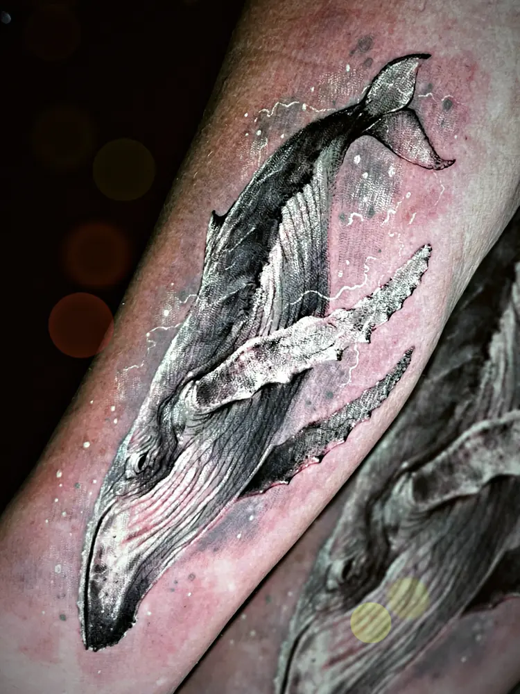 Humpback whale tattoo by Damián Calandra