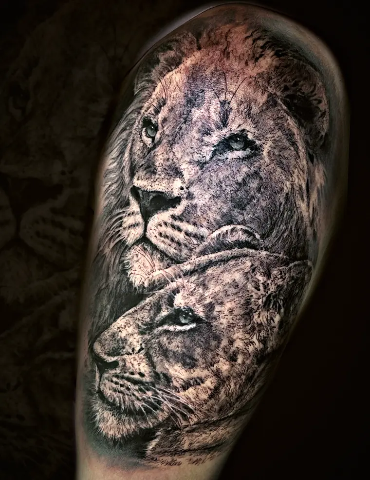 Lion and lioness tattoo by Damián Calandra
