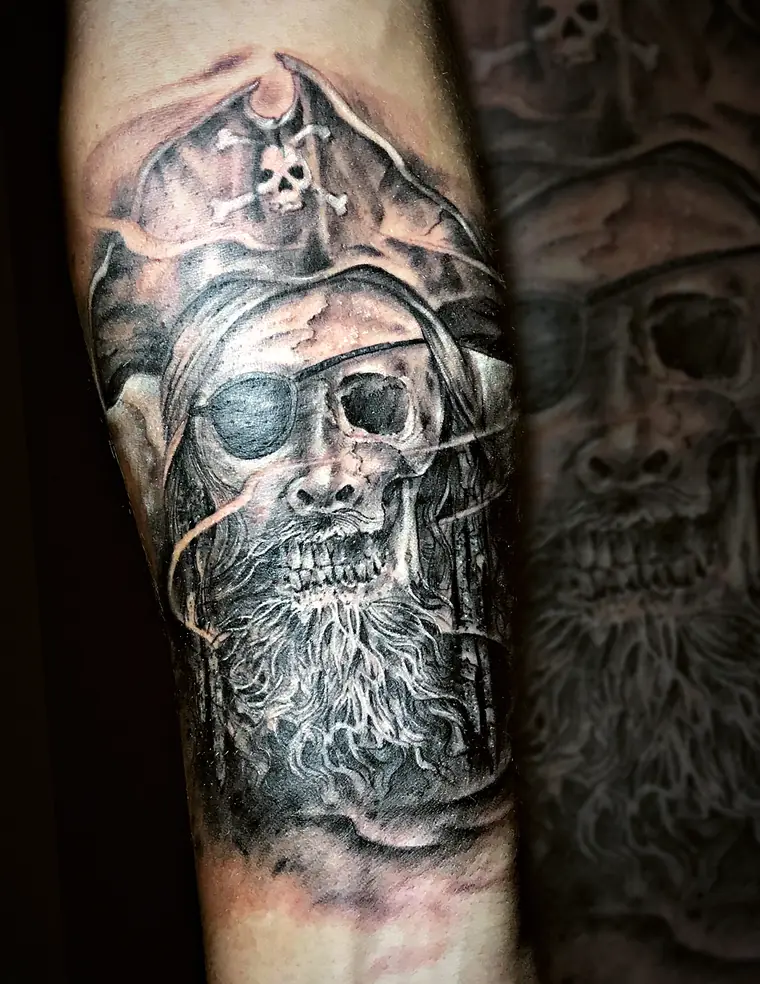 Pirate skull tattoo by Damián Calandra