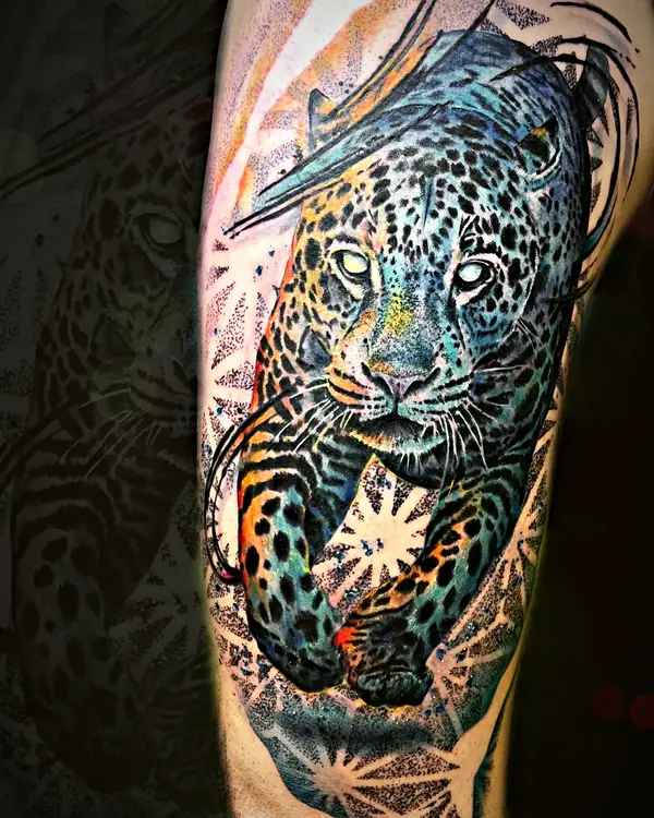 Walking jaguar with abstract strokes tattoo by Damián Calandra