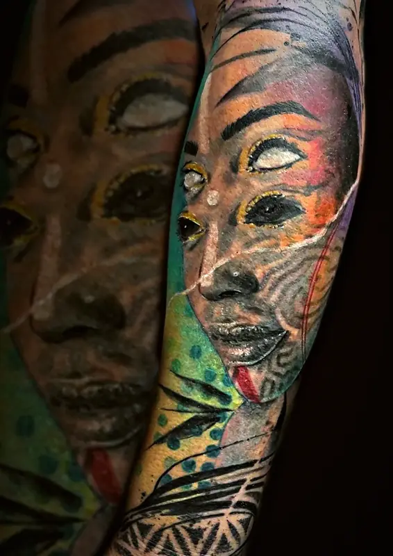 Two-tone woman's face tattoo by Damián Calandra