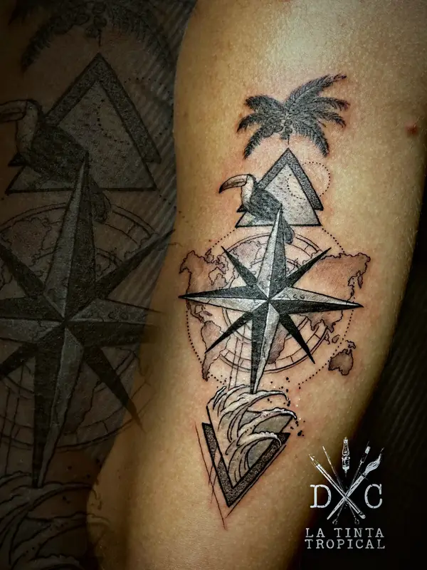 Compass rose with a palm tree tattoo by Damián Calandra