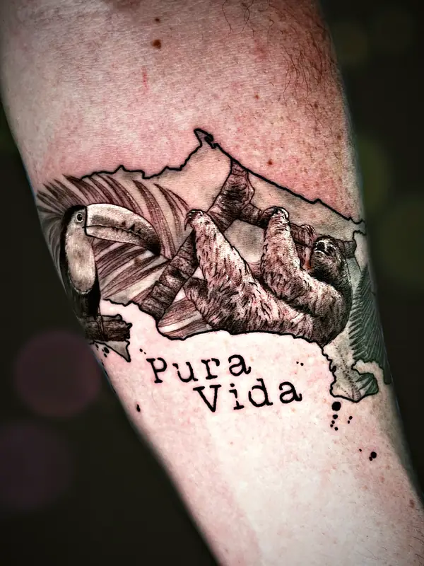 Toucan and sloth with Pura Vida lettering tattoo by Damián Calandra