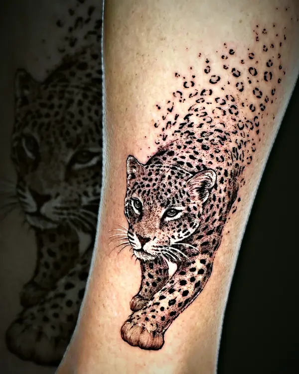 Jaguar dissolving into spots tattoo by Damián Calandra